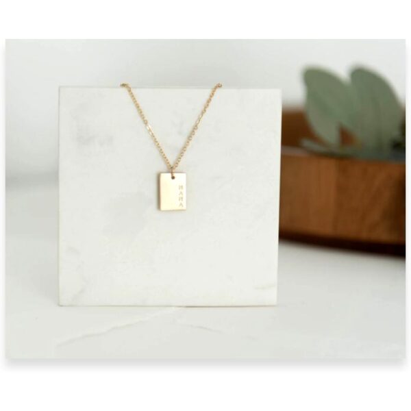 mama necklace on tile gold